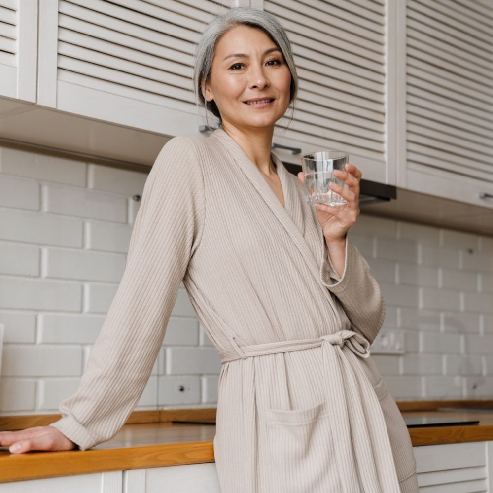 mature-grey-woman-smiling-while-drinking-water-in-2023-11-27-05-01-18-utc (1)